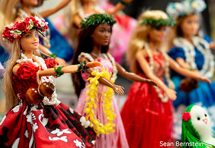 A line of Hawaiian Barbie dolls